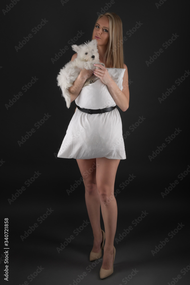 Young woman with West Highland White Terrier Young woman with West Highland White Terrier