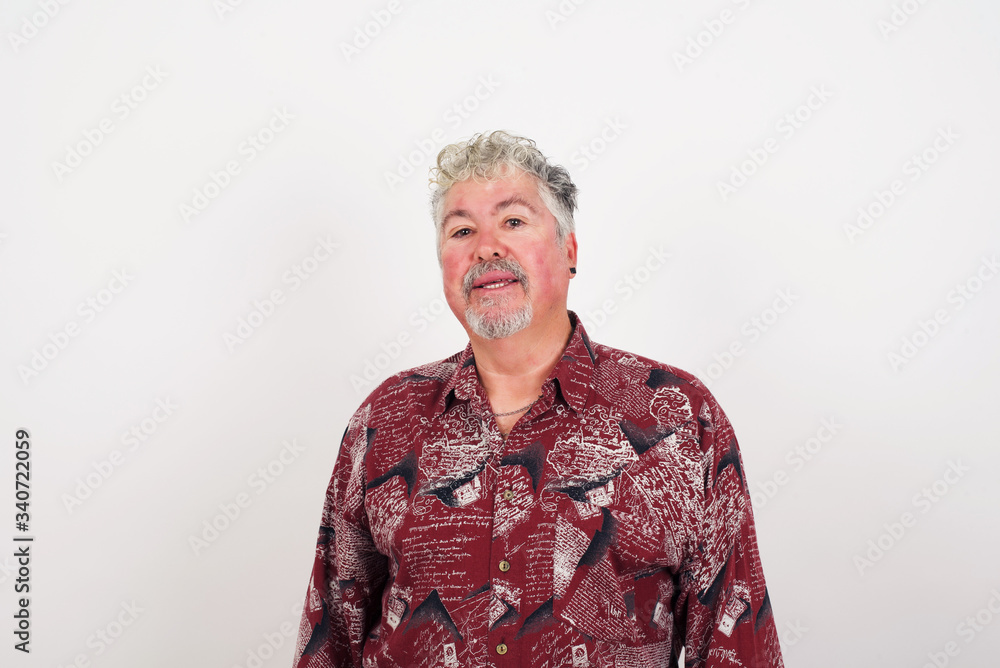 Horizontal portrait of pleasant-looking Caucasian male wearing casual clothes looking happily to the camera. Horizontal portrait of pleasant-looking Caucasian male wearing casual clothes looking happily to the camera.