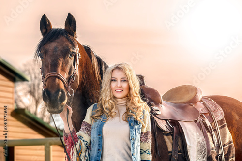 Pretty young girl with the horse