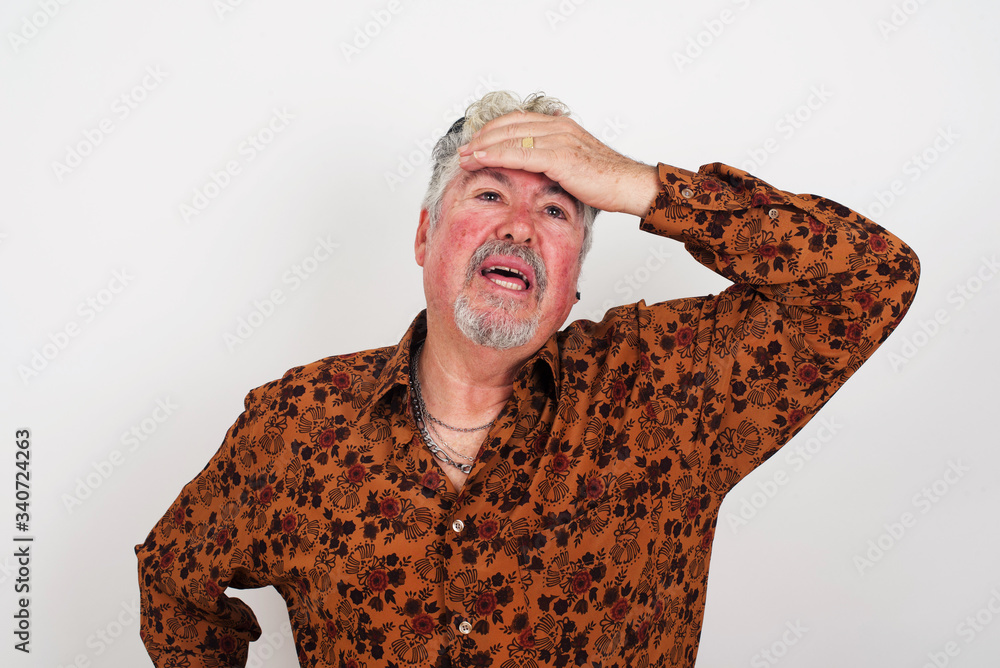 Oops, what did I do? Handsome blond man holding hand on forehead with frightened and regret expression. Wearing casual clothes standing outdoors. Oops, what did I do? Handsome blond man holding hand on forehead with frightened and regret expression. Wearing casual clothes standing outdoors.