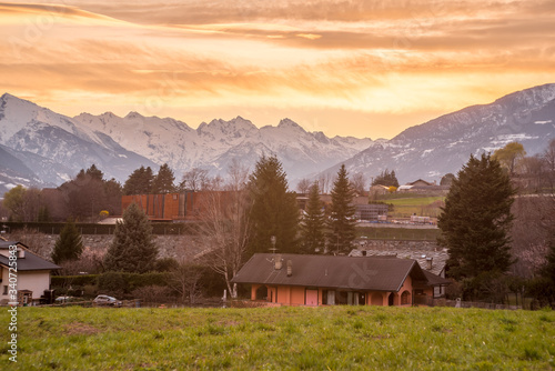 rural landscape at sunset, Italian mountains in the background © mashiro2004