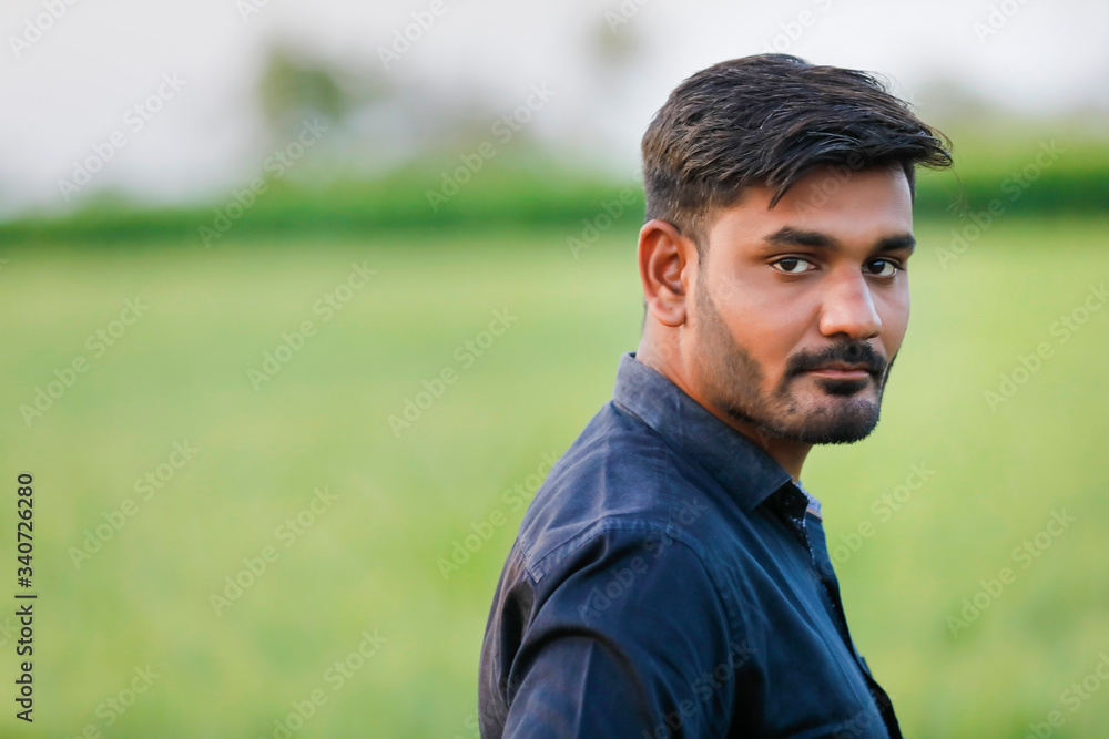 young indian banker at field young indian banker at field