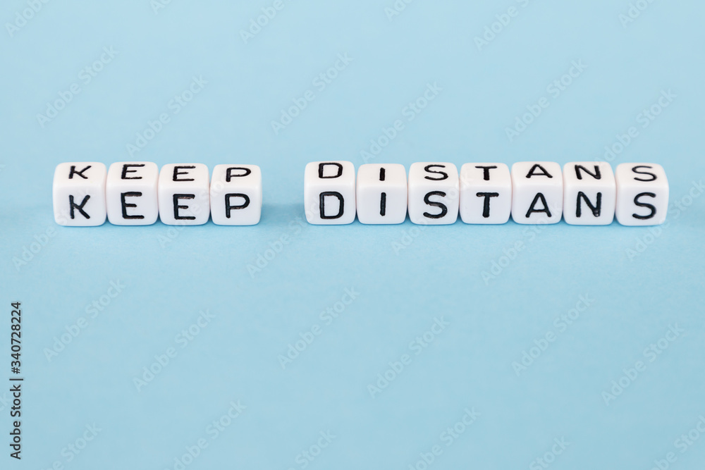 word composed with cubes on a blue background word composed with cubes on a blue background