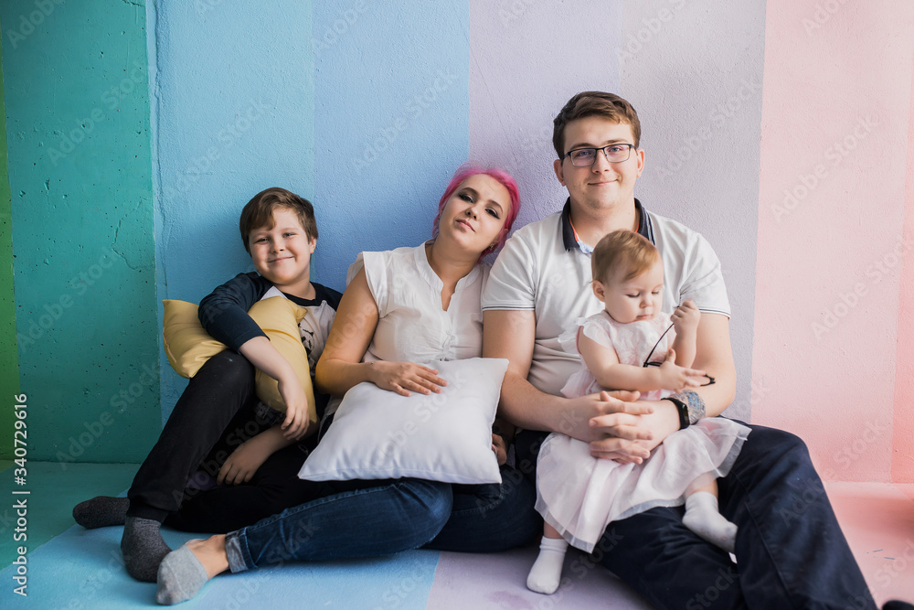Young parents with daughter and son Young parents with daughter and son