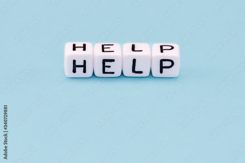 word composed with cubes on a blue background word composed with cubes on a blue background
