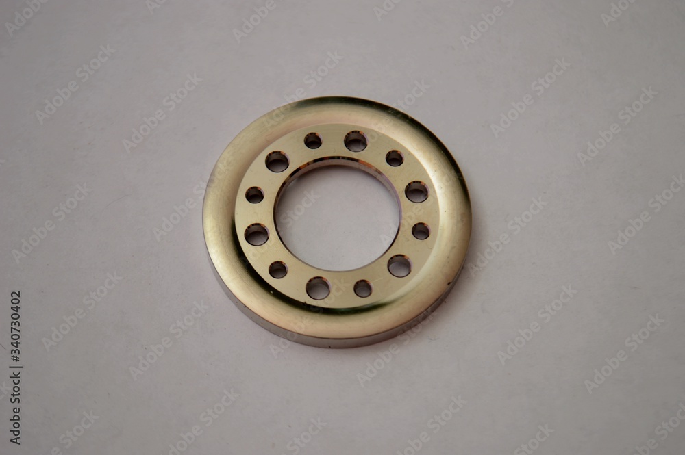 close-up of a chrome washer with holes close-up of a chrome washer with holes
