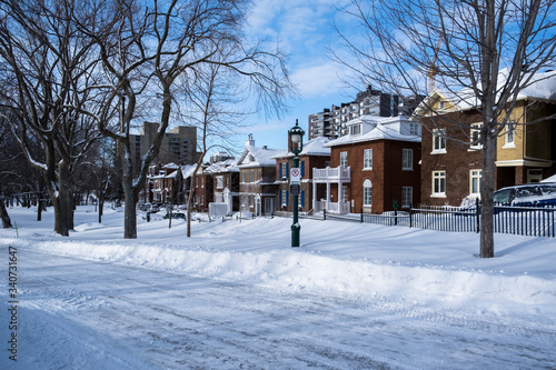 Houses and street covered with lot of snow in Canada