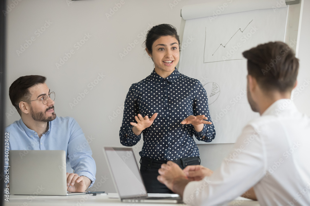 Hindu lady ceo negotiates with investors in boardroom. Business trainer give presentation explanation to company staff at seminar, corporate assistant provide information engaging participants concept Hindu lady ceo negotiates with investors in boardroom. Business trainer give presentation explanation to company staff at seminar, corporate assistant provide information engaging participants concept