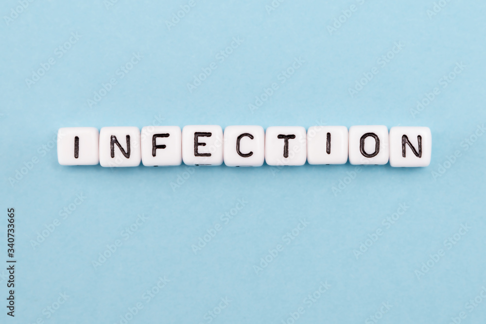 word composed with cubes on a blue background word composed with cubes on a blue background
