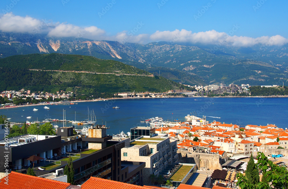 Panoramic view of the Budva Riviera travel destination from the beach Mogrenof the fortress of the Old Town. Budva - one of the best preserved medieval cities in the Mediterranean, Montenegro, Europe
