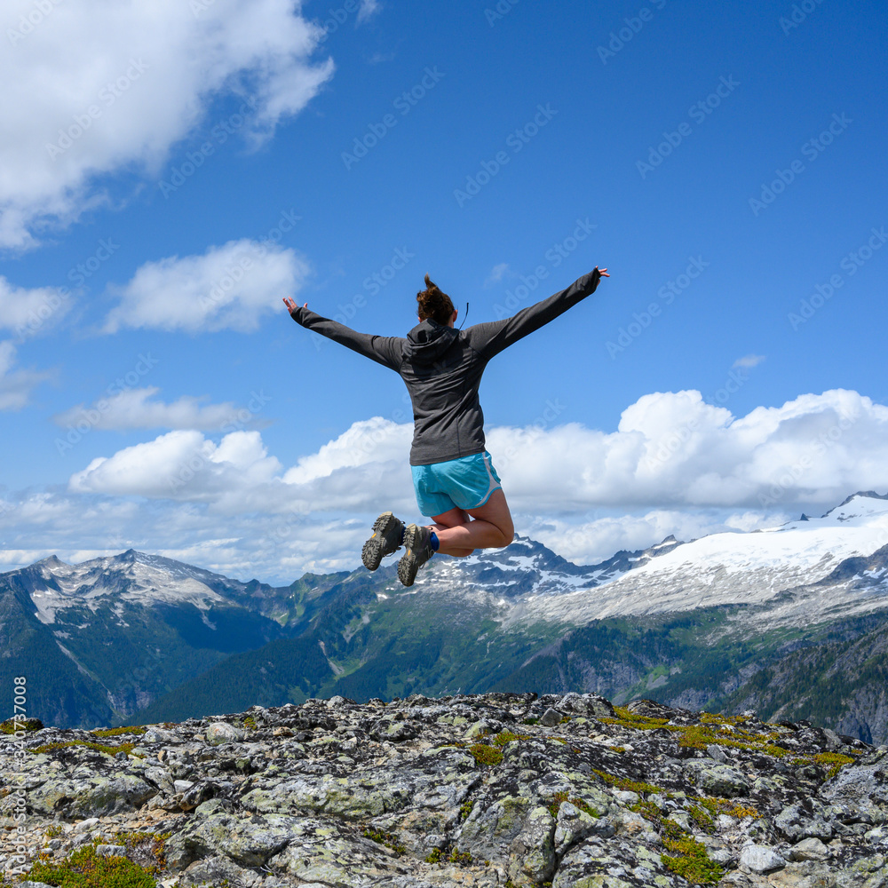 Woman Soars Over Rocky Overlook in North Cascades Woman Soars Over Rocky Overlook in North Cascades