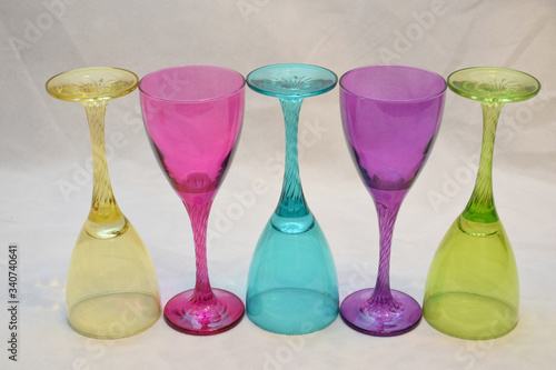 Mock up design set of elegant and traditional drink ware / drinking glass & Jar for wine or juice, colorful transparent isolated on black background 