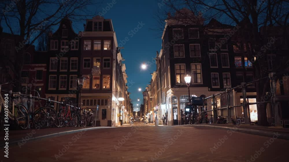 Empty Amsterdam downtown streets in evening, closed restaurants and stores in historical center due to Coronavirus Covid-19 and quarantine in city Empty Amsterdam downtown streets in evening, closed restaurants and stores in historical center due to Coronavirus Covid-19 and quarantine in city