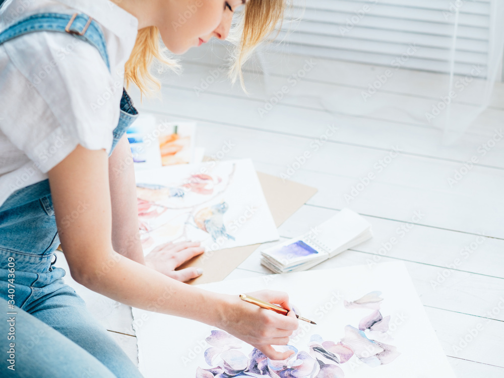 Art hobby. Imagination talent skills. Inspired woman sitting on floor painting flowers. Art hobby. Imagination talent skills. Inspired woman sitting on floor painting flowers.