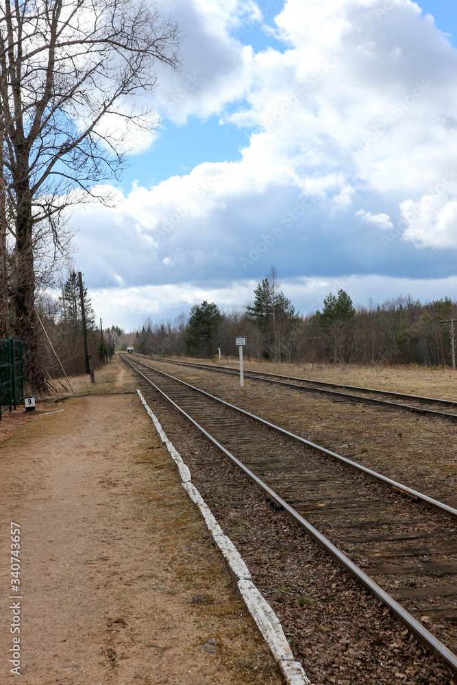 Fototapeta premium spring view of old railway platform in the in the Russian outback