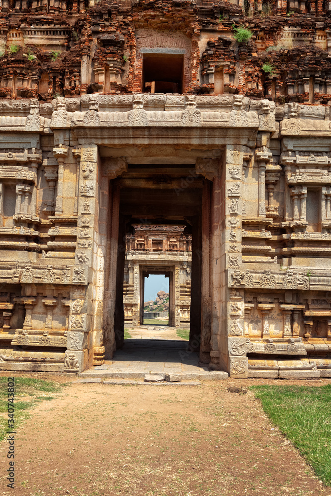 Gates in gopuram (gopura - tower, usually ornate, at the entrance of any South India Hindu temple) in Achyutaraya Temple. Ruins in Hampi, Karnataka, India