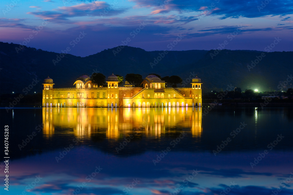 Rajasthan famous tourist landmark - Jal Mahal Water Palace on Man Sagar Lake in the evening in twilight. Jaipur, Rajasthan, India