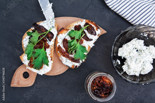 Flat lay sandwiches with croutons, cottage cheese and sun-dried tomatoes photo