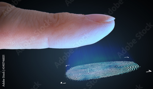 Scanning fingerprint from finger. Biometric and security concept. photo