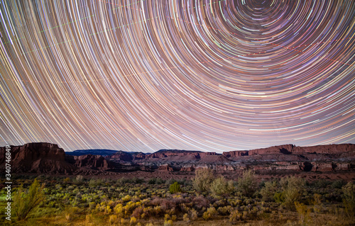 Star trails over desert landscape in Capitol Reef National Park, Utah