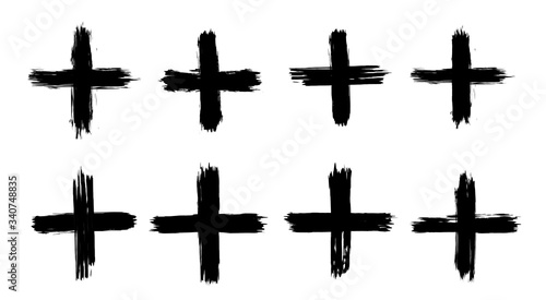 A collection of plus signs in grunge style. 8 highly detailed and different crosses. High quality manually traced. Plus black isolated on white background, vector illustration.