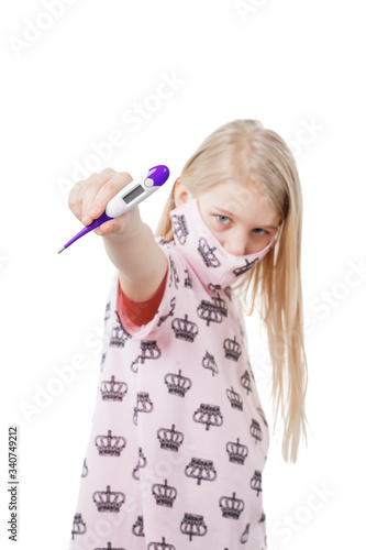 Young blonde girl in the pink mask and blouse presents the thermometer