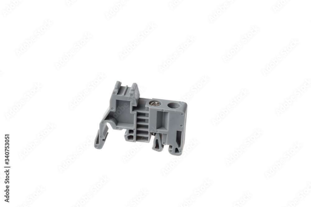 Grey stopper block for electrical pass through terminal for DIN rail, isolated on white background Grey stopper block for electrical pass through terminal for DIN rail, isolated on white background