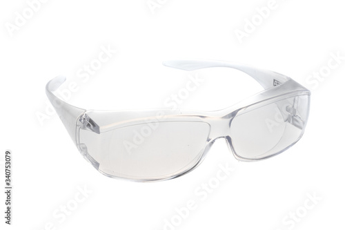 Clear transparent safety plastic glasses for over persription glasses wear, isolated on white background