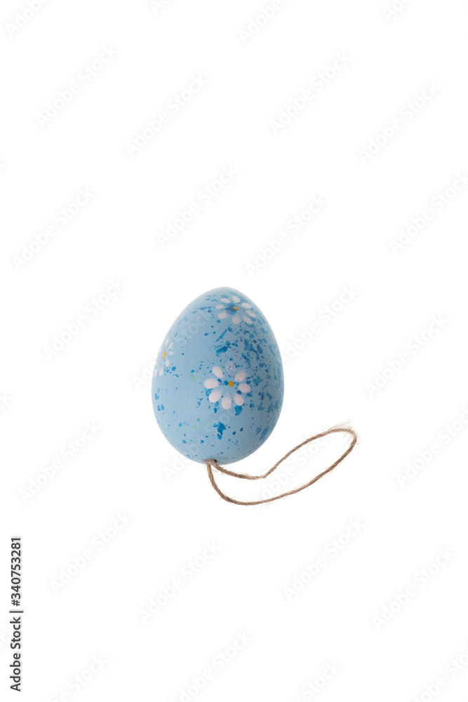 Blue decorative eater egg with flowers and spots, isolated on white background Blue decorative eater egg with flowers and spots, isolated on white background