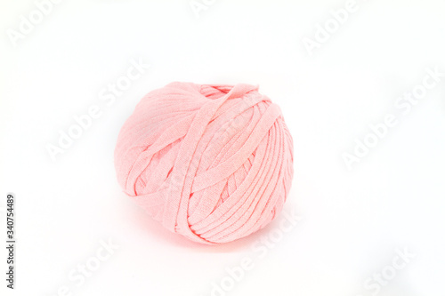 Salmon ball of wool. Isolated. Crafts and sewing. Indoor leisure. Be at home