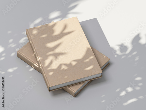 Two beige books Mockup with textured kraft hardcover on white table outdoor