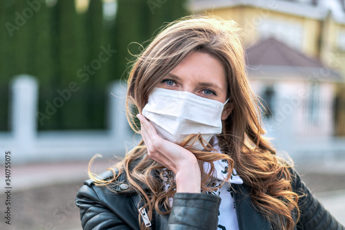 Virus mask. COVID-19. Woman walking in public space wearing face protection in prevention for coronavirus.