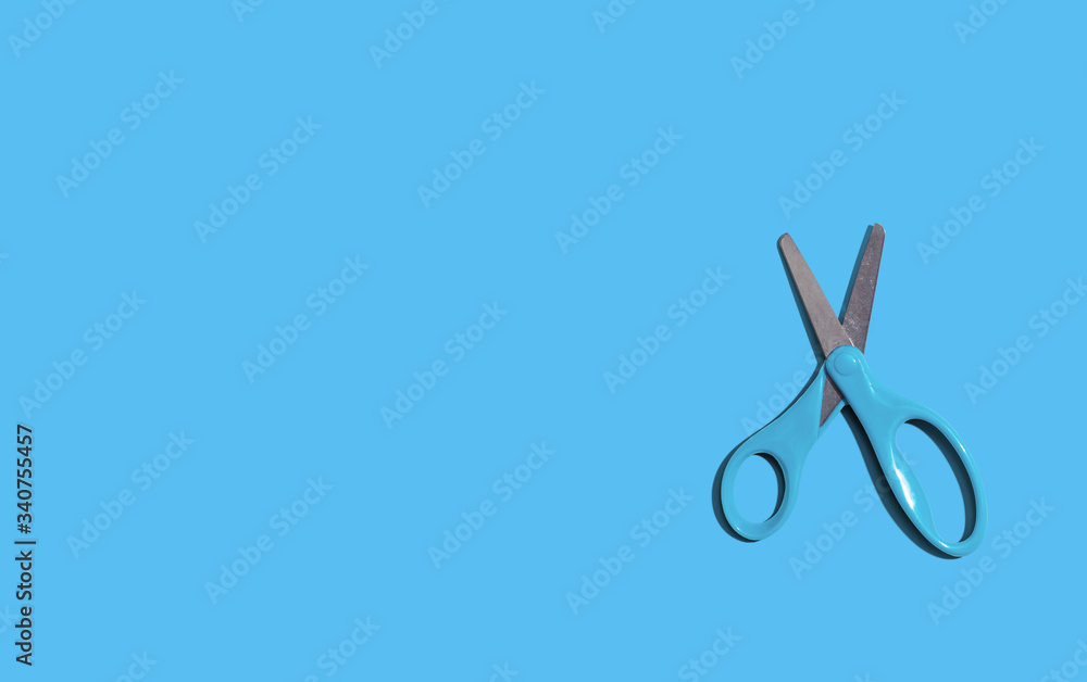 Scissors with dropped shadow from above - overhead view Scissors with dropped shadow from above - overhead view