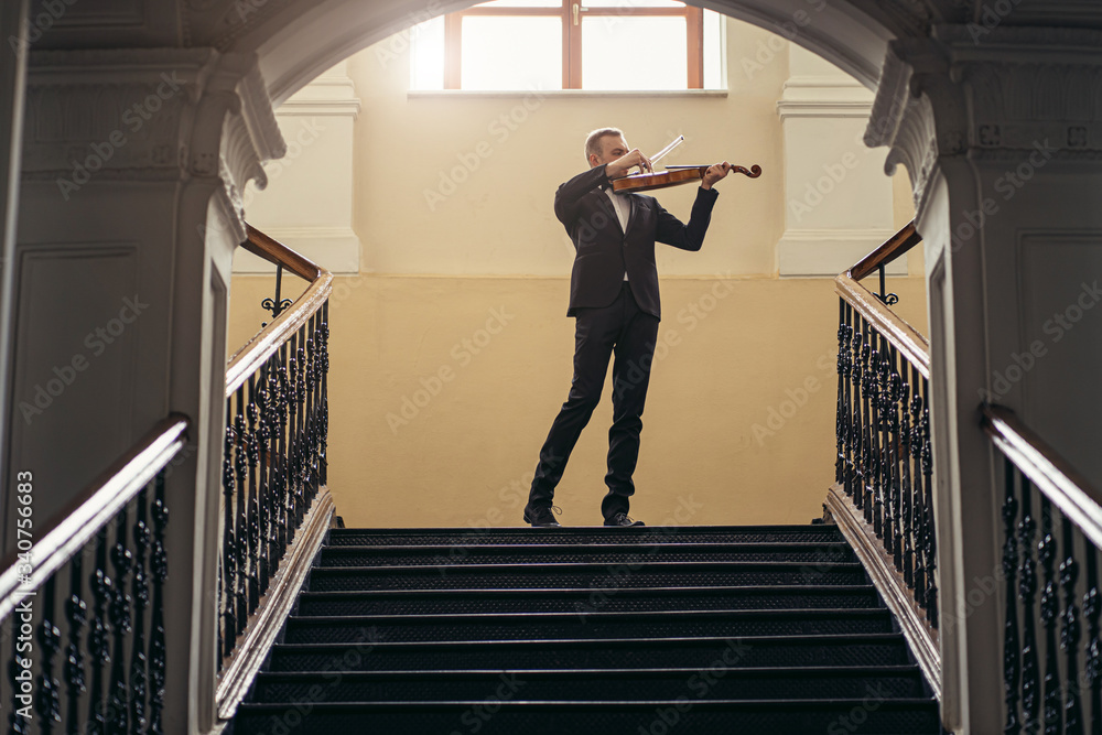 young professional musician man play violin, practicing, performing classic music. music, instruments, art concept