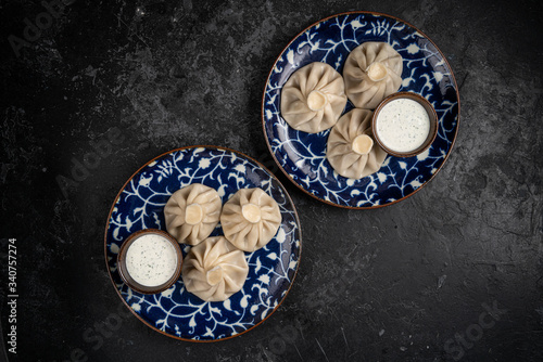 khinkali cooked on blue plate