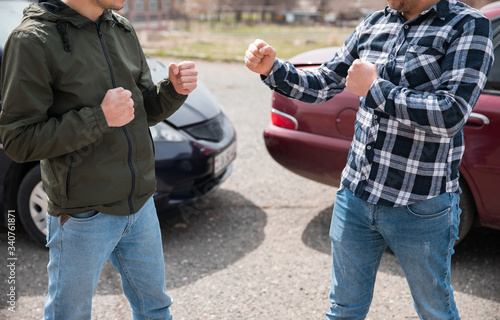 car accident and men fight