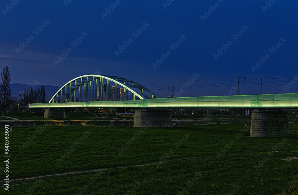 The railway bridge over the Sava River in Zagreb, popularly called the Hendrix Bridge. Illuminated by LED light.