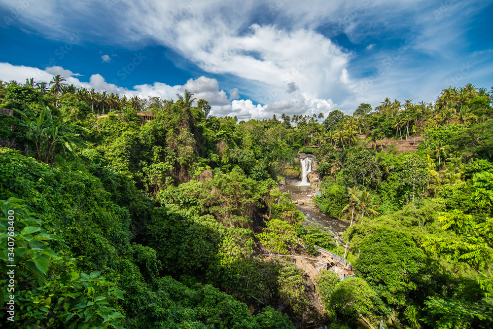 Bali, Indonesia - February, 2020: Tegenungan Waterfall is a beautiful waterfall located in plateau area and it is one of places of interest of Bali