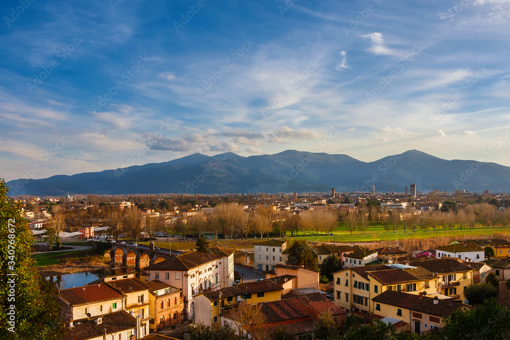 View of Lucca historic center with its famous medieval towers and River Serchio from Monte San Quirico panoramic terrace