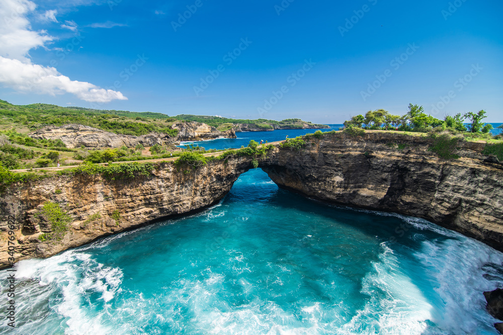 Panoramic view of broken beach in Nusa Penida, Bali, Indonesia. Blue Sky, Turquoise Water.