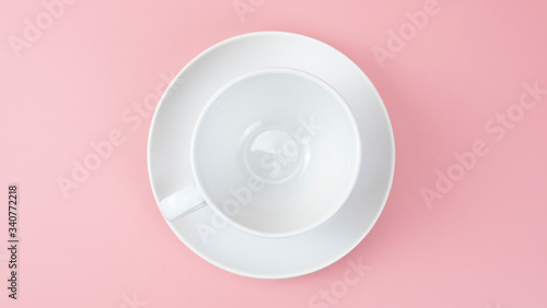 White cup isolated on pink background, Top view Food concept.