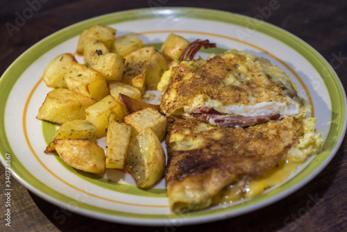 exquisite omelette with bacon and Argentine fries © aletanevitch