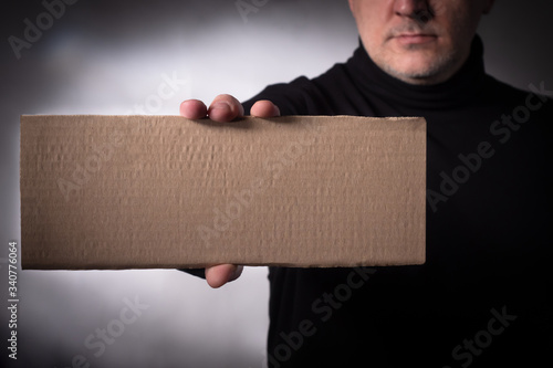A man in a black sweater is...