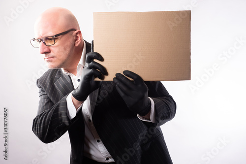 A man in rubber gloves with...
