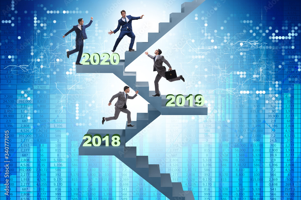 Businessman climbing stairs on yearly basis Businessman climbing stairs on yearly basis