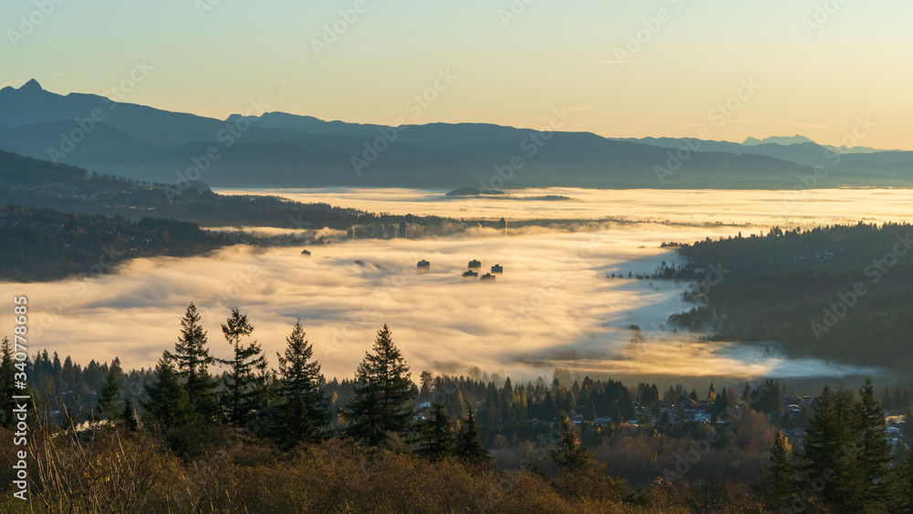 sunrise over mist (inversion) covering valley floor as far as the eye can see
