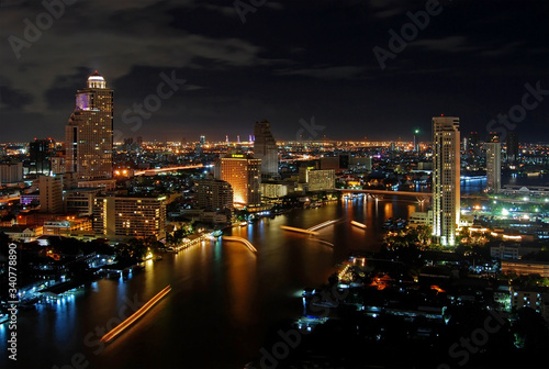 Skyline of Bangkok and the Chao Phraya river at night, Thailand.