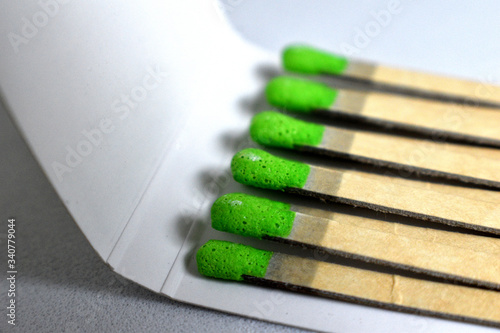 Green matches in matchbook close up