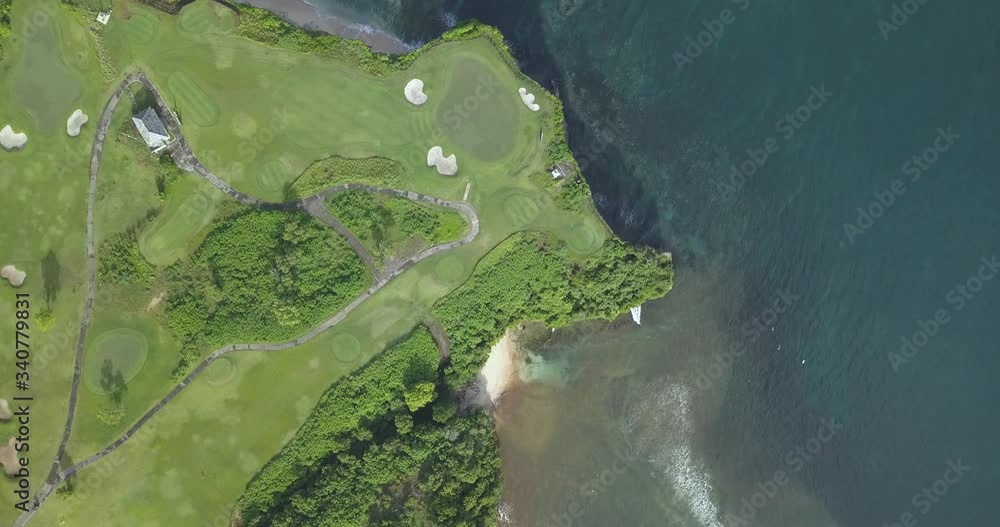 Aerial view of golf course with bunker and green at coast,Bali,Indonesia Aerial view of golf course with bunker and green at coast,Bali,Indonesia