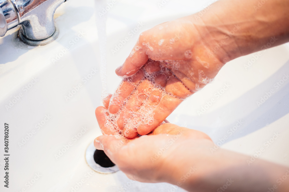 Fototapeta premium wash your hands under water